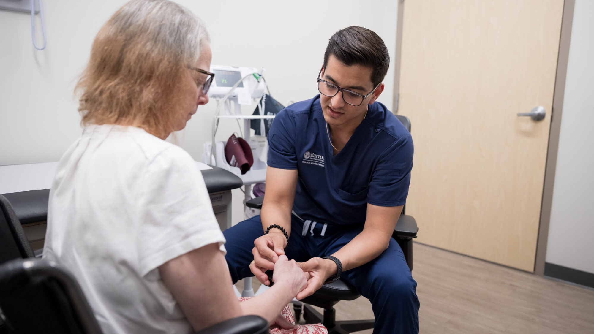 stroke neurologist daniel gonzalez treats a patient in at the petznick strock center