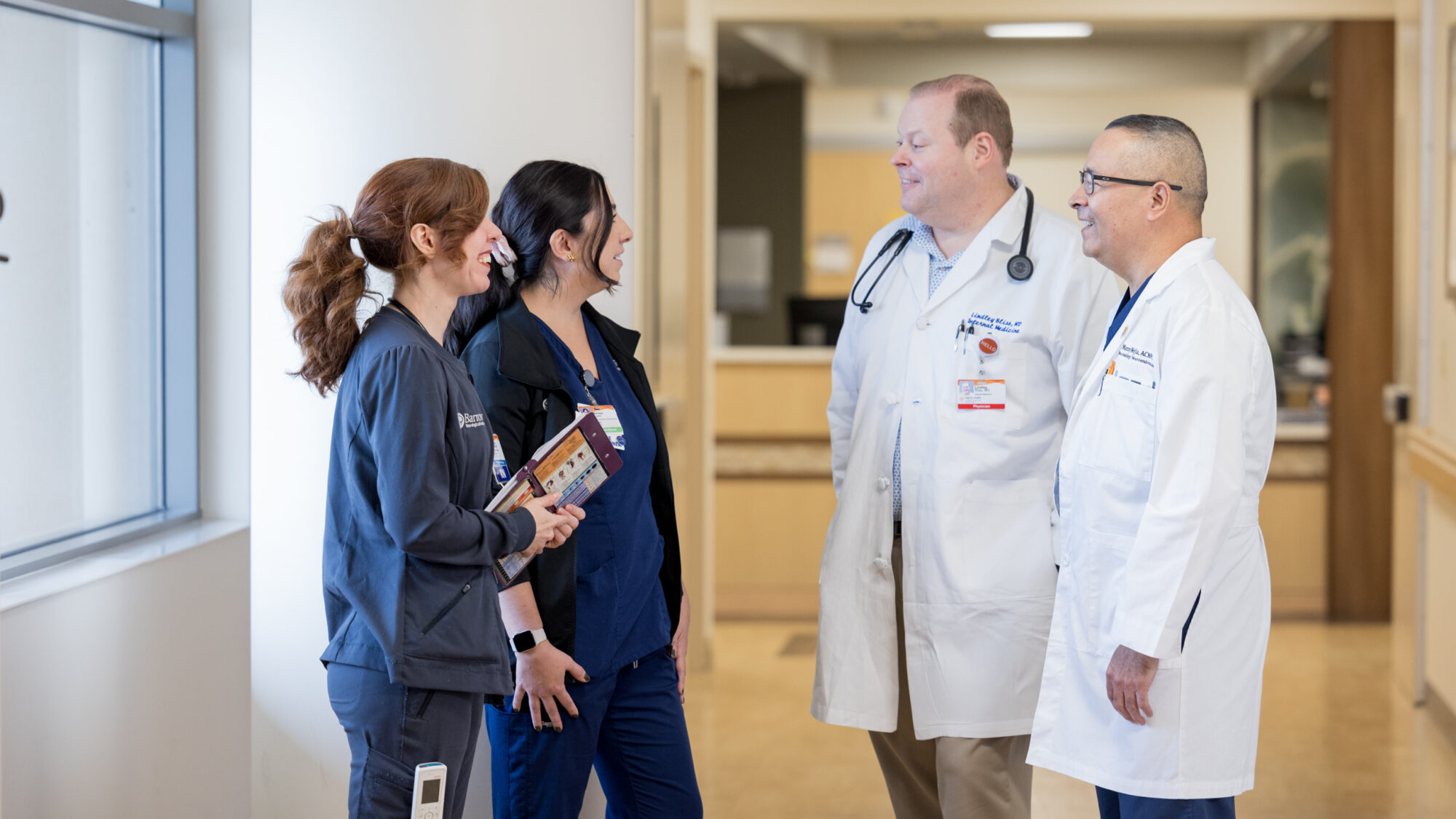 Barrow nurses conversing with a physician