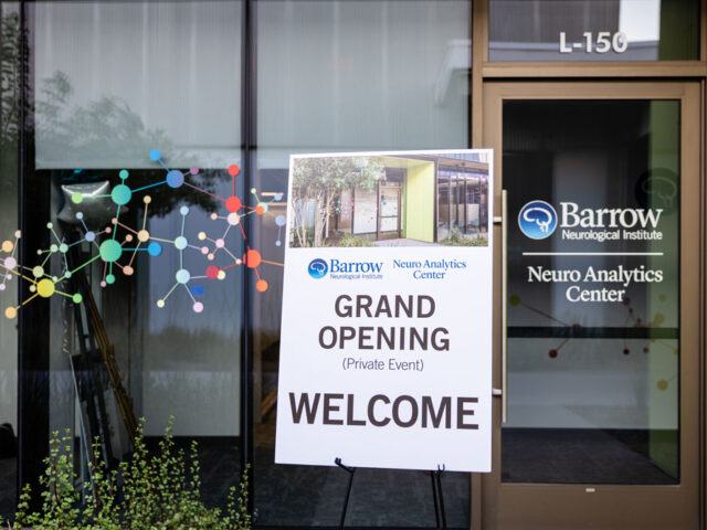 Photo of entrance to Barrow Neuro Analytics Center with a sign advertising the grand opening event.