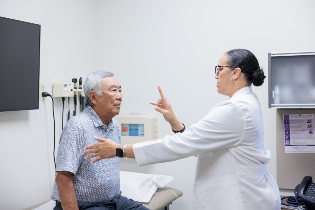 neurologist courtney schusse performs a neurological exam on an epilepsy patient