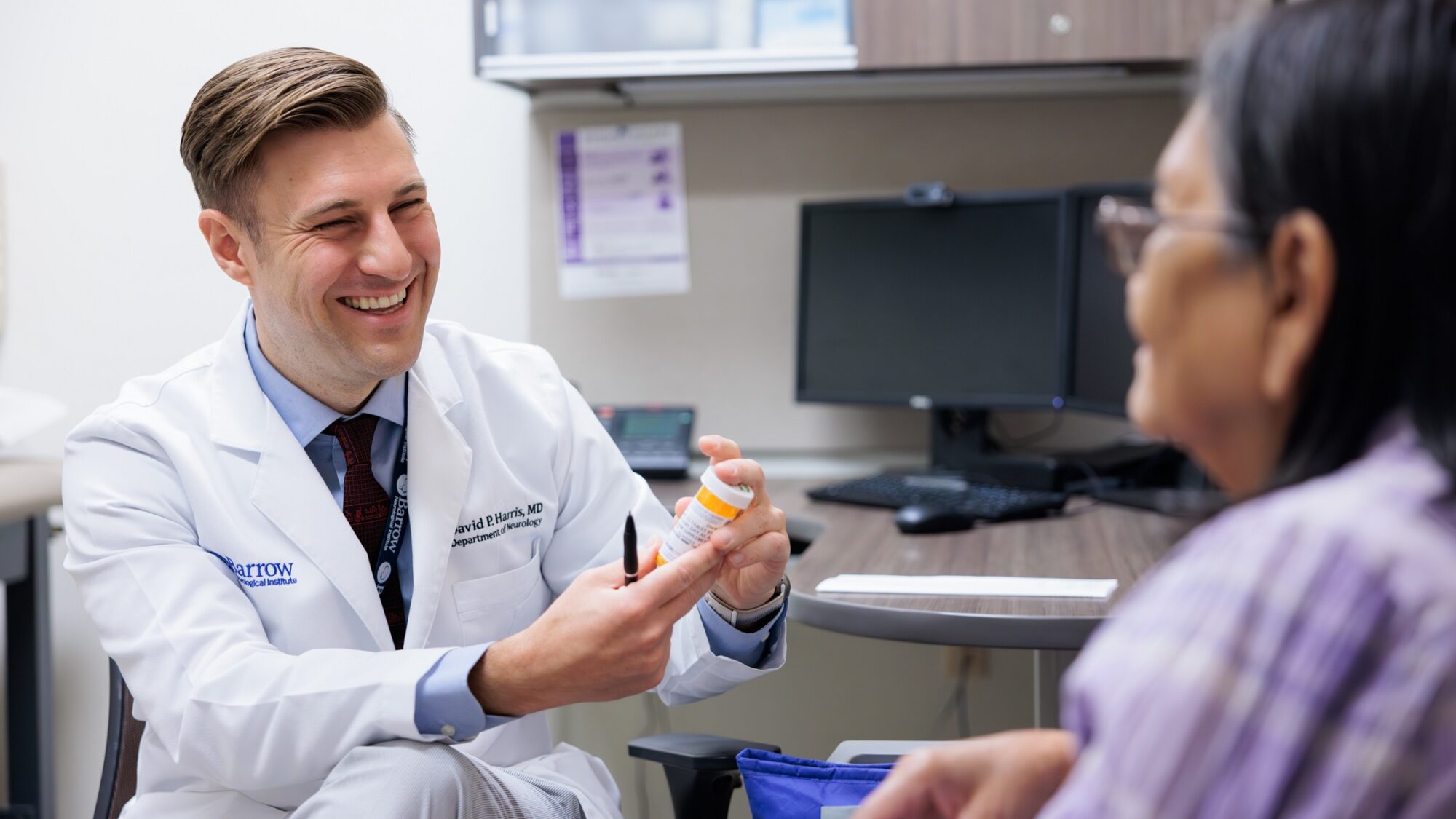 neurologist david harris discusses medications with an epilepsy patient