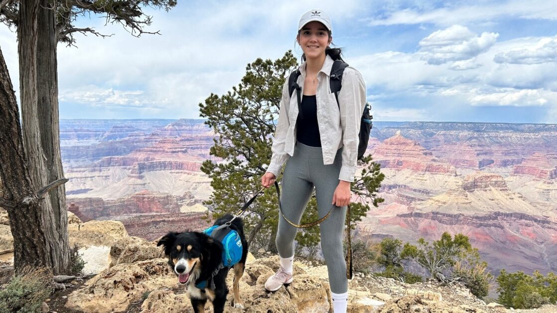 diana monge sanchez with a dog posing in front of the grand canyon