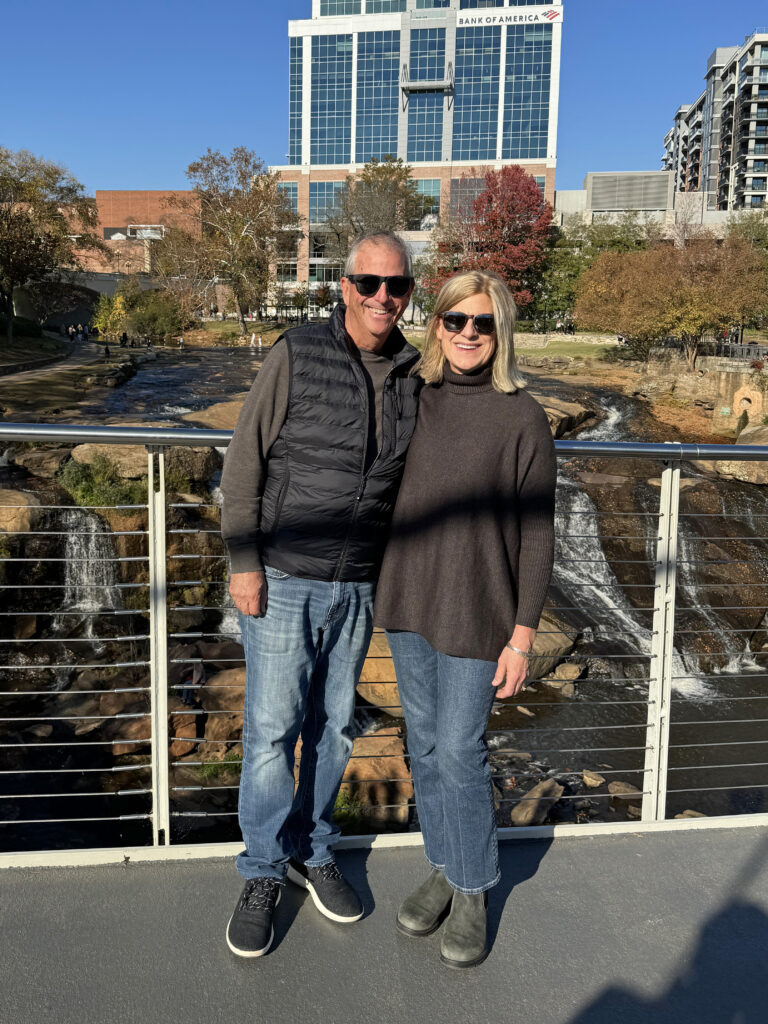 John and his wife, Elizabeth, pose for a photo on a bridge in South Carolina