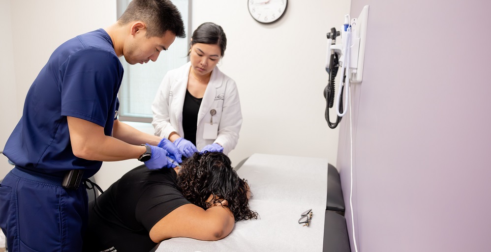 neurology resident kyle kaneko performs a botox injection for movement disorders under the supervision of attending neurologist justine chan