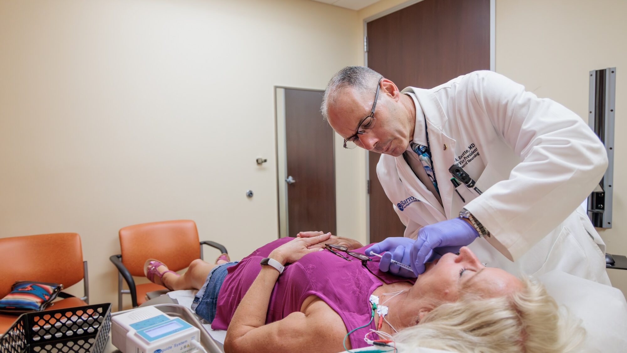 neurologist brad racette administers botox to a patient with parkinson's disease